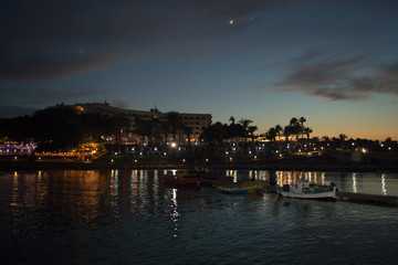Obraz premium Night walking along wharf near Louma Beach at in Pernera, Cyprus on June 16, 2018. 