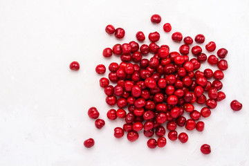 Fresh cherry on a light stone background. Concept of harvest. Flat lay, top view