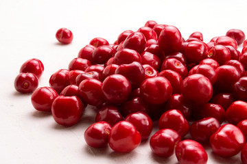 Fresh cherry on a light stone background. Concept of harvest