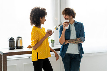 Colleagues having a coffee break in the office