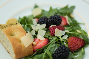 fresh salad with berries and cheese