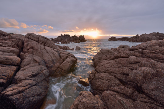 Italy, Sardinia, Cala Rossa, Costa Paradiso, rocky coast at Cala Rossa at sunset