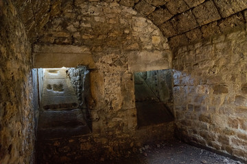 vaulted cellar of castle ruin low light