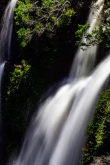 Closeup of blurred water motion in a waterfall