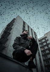 Man on the background of a high-rise building © Максим Ермак