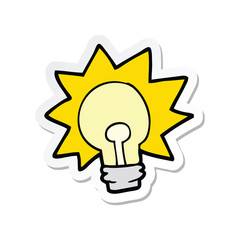 sticker of a cartoon shining light bulb