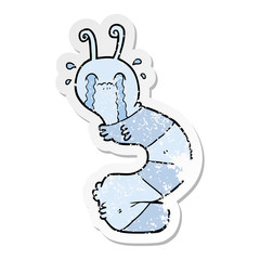 distressed sticker of a cartoon crying caterpillar