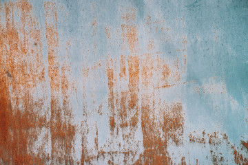 Rust on metallic surface. Iron texture. Partly rusty background. Rough oxide plate close-up. Hard decay of metal. Oxidation of steel. Chemical reaction. Partially rusted metal panel with peeling paint