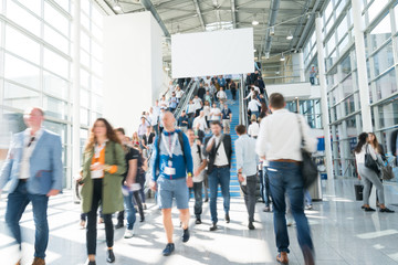 blurred people at a trade fair