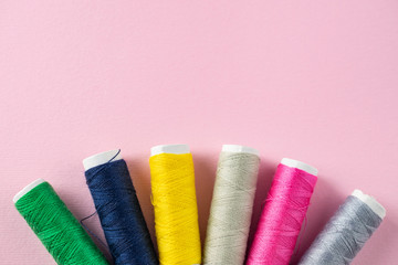 Color sewing threads on white background