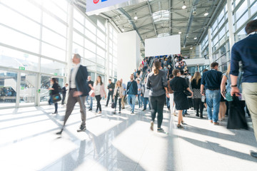 blurred people at a trade fair