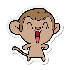 sticker of a cartoon laughing monkey