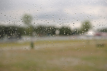 Natural beauty of raindrops on windscreen on gray background