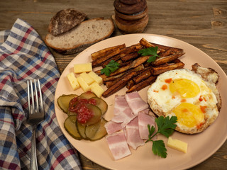 Breakfast fried eggs, bacon, potatoes