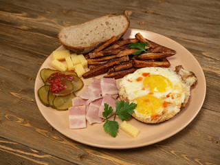 Breakfast fried eggs, bacon, potatoes