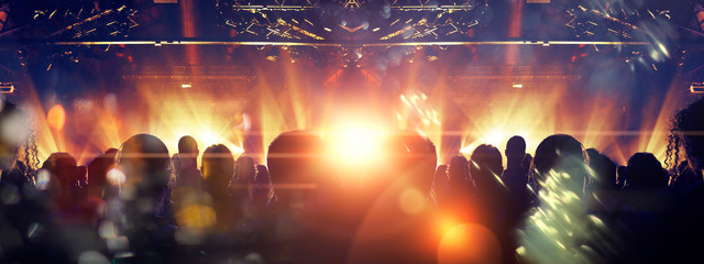 Inside a concert venue with people