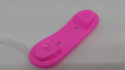 pink plastic toy phone