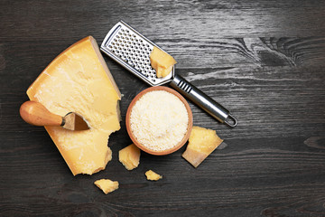 Parmesan cheese on wooden board