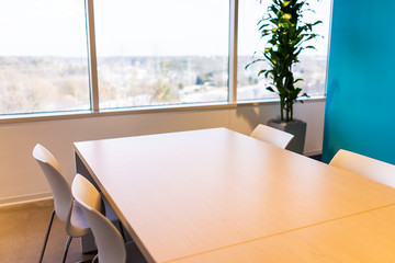 New modern office table in building with wooden meeting corporate business closeup by glass window and many chairs empty nobody