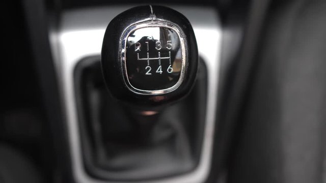 Driver Changing Gears with Manual Transmission Gear Stick