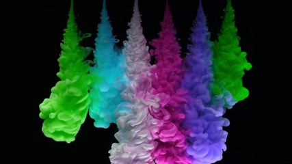 Super slowmotion shot of colorful inks in water. Shot with high speed camera at 4K.