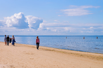 People relaxing at Sandy beach on Baltic Sea in Jurmala