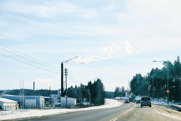 Landscape and car in road in snowy winter Lapland