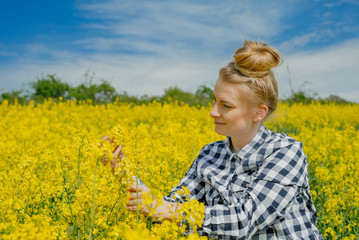 Fototapeta premium Farmer examining rape