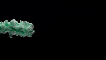 Super slowmotion shot of green ink in water. Shot with high speed camera at 4K.