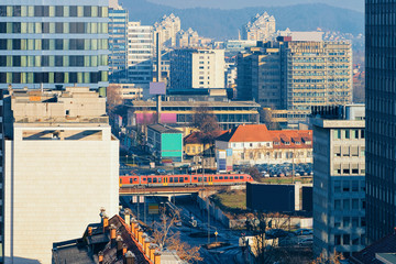 Fototapeta premium Busy modern downtown with city center architecture in Ljubljana