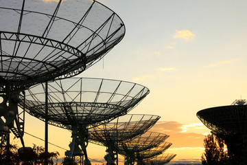 The silhouette of a radio telescope