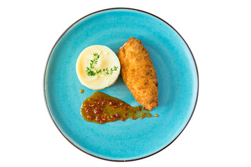 mashed potatoes, chicken nuggets and red sauce on a white isolated background