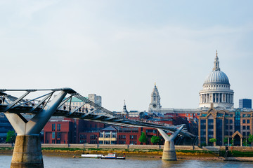 Fototapeta na wymiar St Paul Cathedral and Millennium Bridge over Thames River London