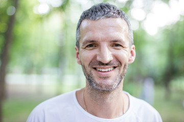 Portrait of happy attractive man outdoors