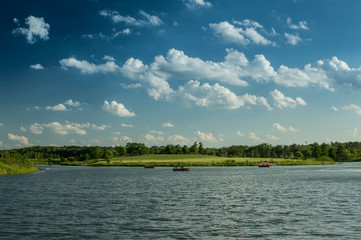 Weekend boating summer recreation. Lake landscape.