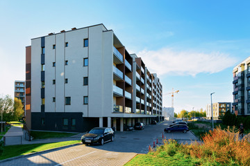 Apartment home residential building and cars parked in street