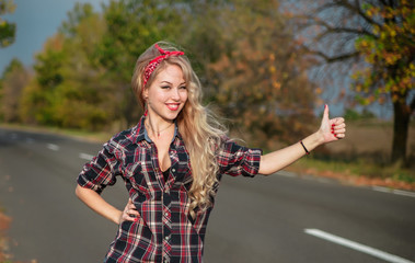 Beautiful pin up girl on the road.