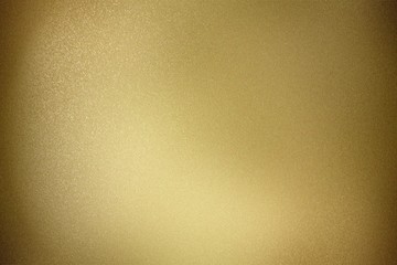 Gold metal wall in dark room, abstract texture background