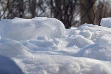 Uneven landscape of deep clumpy beautiful snow from multiple heavy snow falls