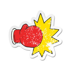 retro distressed sticker of a cartoon boxing glove