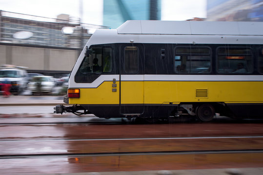 City Train Zooming Through Downtown