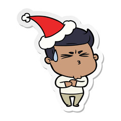 sticker cartoon of a frustrated man wearing santa hat