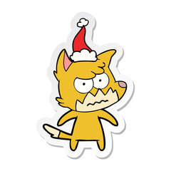 sticker cartoon of a annoyed fox wearing santa hat