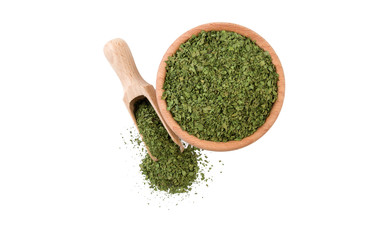 coriander leaves  in wooden bowl and scoop isolated on white background. top view. Spices and food ingredients.