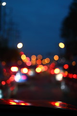 car driving on night road city, blur light traffic background