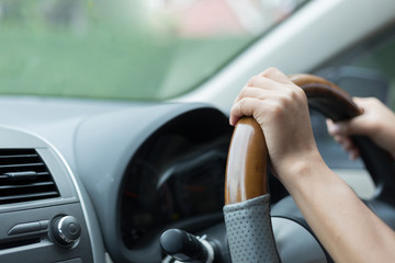 woman hand holding control steering wheel driving car road trips travel in the morning day