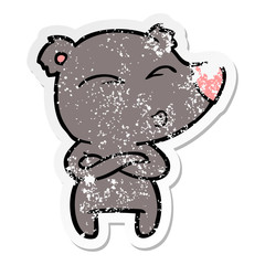 distressed sticker of a cartoon whistling bear