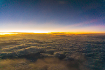 Colorful sunrise sky with cloud above view from airplane