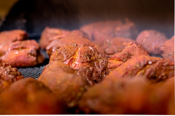 meat on the grill pit smoker