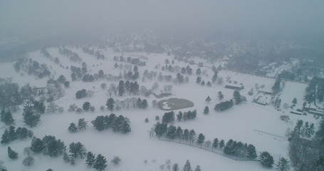Fototapeta na wymiar An aerial view of Lake Needwood in Rockville on a snowy day